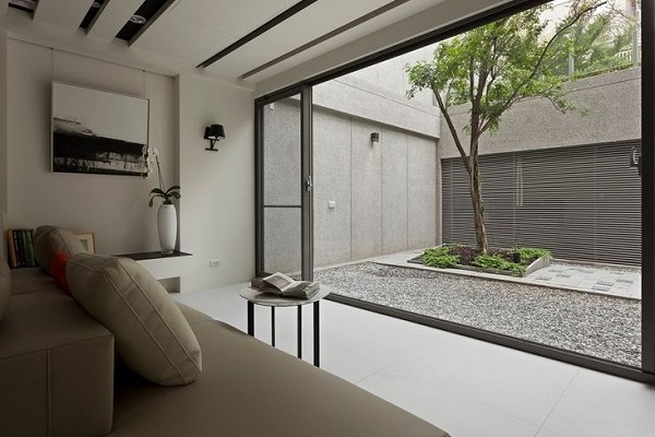 Living room connected to courtyard for getting nature view