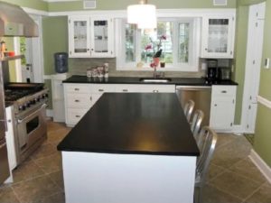 White-black kitchen cabinet island with green walls for kitchen interior design