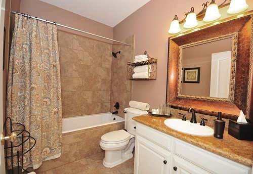 Beige color bathroom interior design.