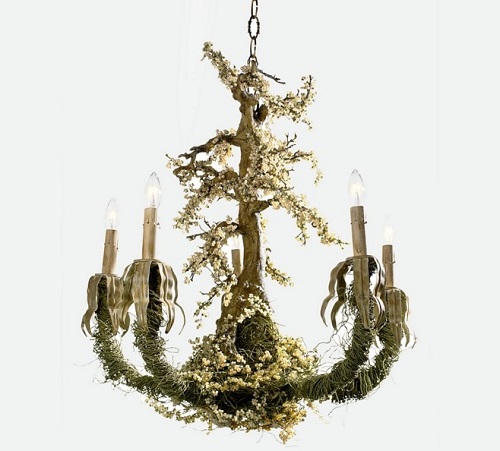 Chandelier that appears next to forest.