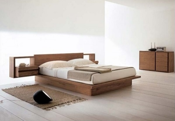 Simple white bedroom design with wooden bed and furniture