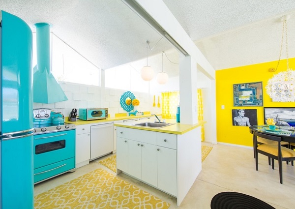 White kitchen island decor with yellow countertop and walls