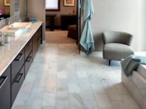 Ceramic tiles install on bathroom floor