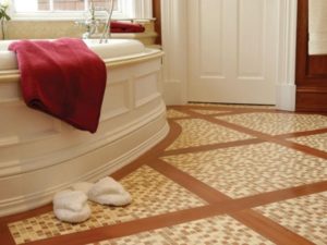 Stone tiles install on bathroom floor