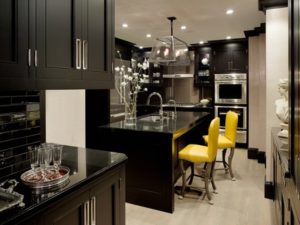 Yellow chairs enhance beauty of black kitchen interior design