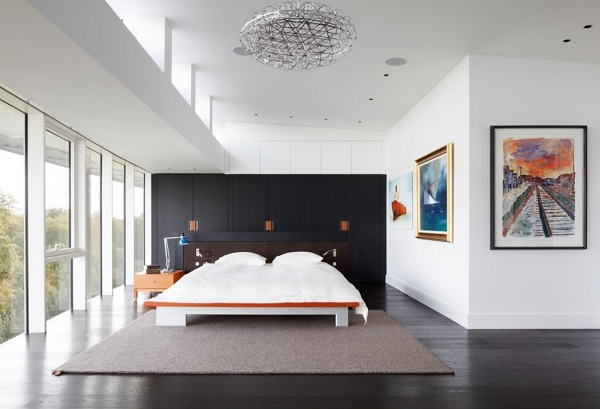 Black wardrobes in white bedroom