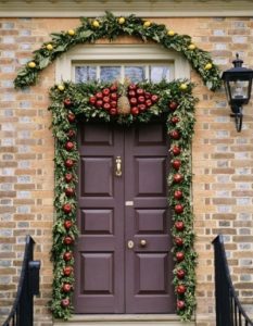 Decor Christmas door with apple, pineapple fruits